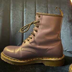 Navy blue Dr. Martens boots.
